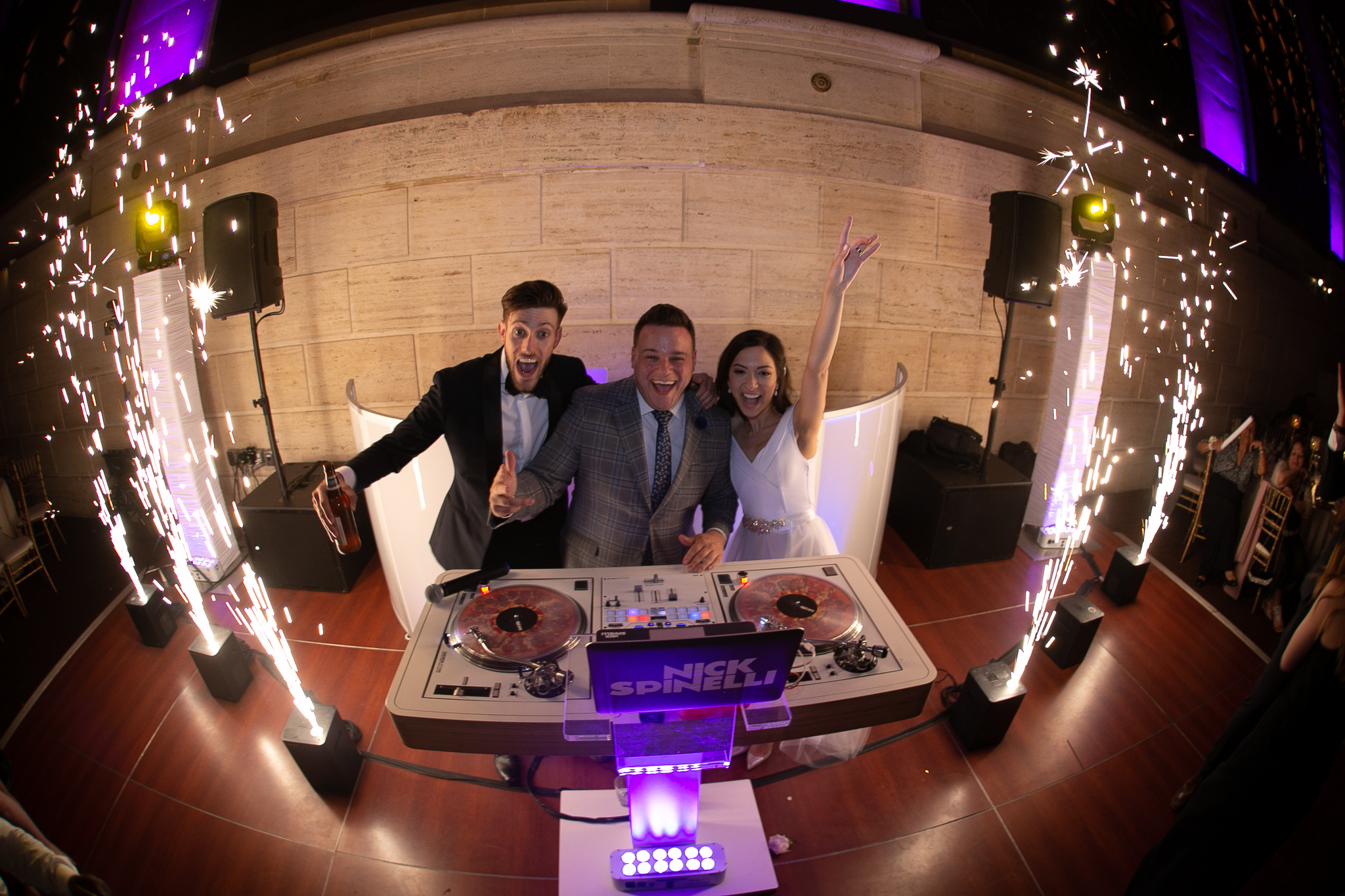 Couple celebrating at the DJ booth