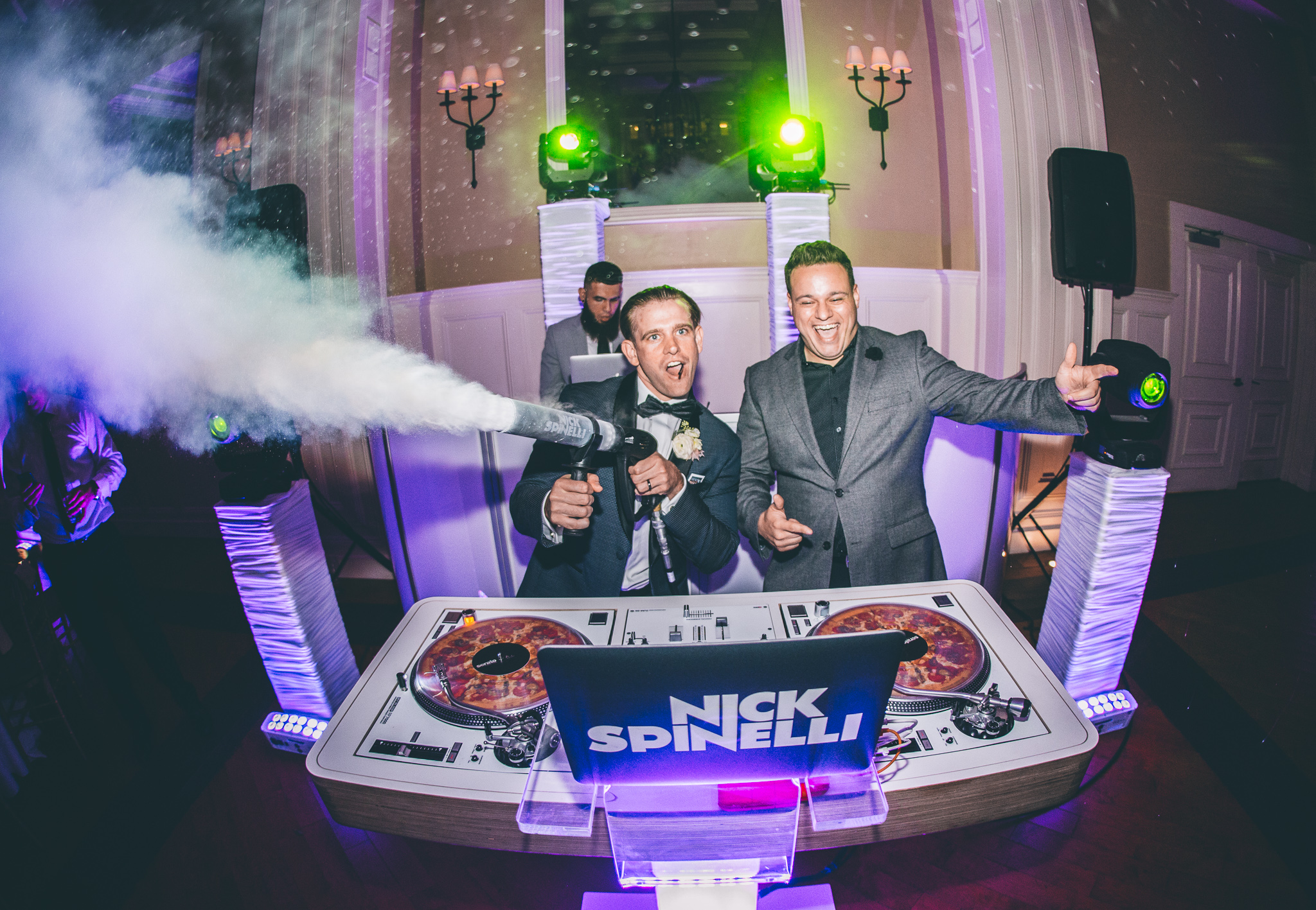 Nick Spinelli firing a cryo cannon over a packed wedding floor